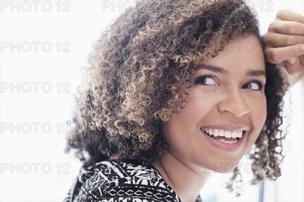 Mixed race woman smiling