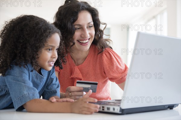 Mother and daughter shopping online