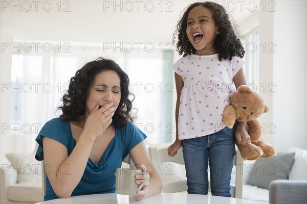 Girl shouting at stressed mother