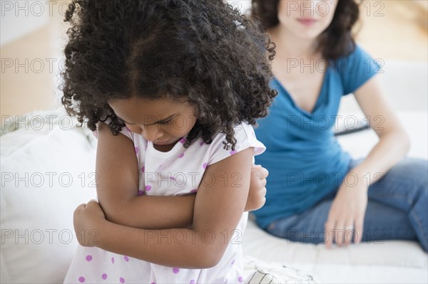 Frustrated girl ignoring mother