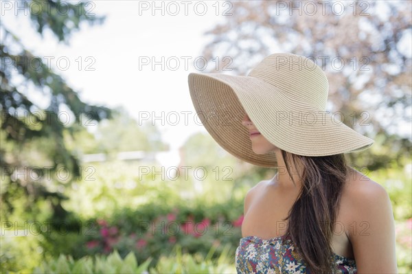 Caucasian woman wearing sun hat outdoors