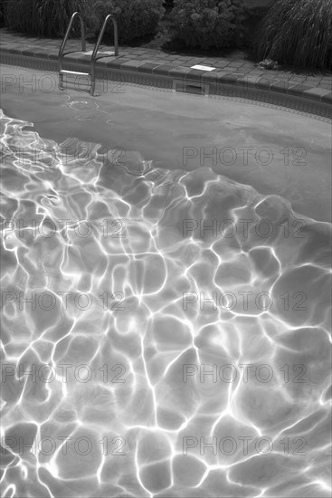 High angle view of sunbeams in swimming pool