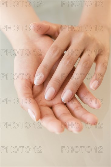 Close up of hands of Hispanic woman