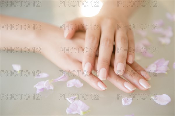 Close up of hands of Hispanic woman