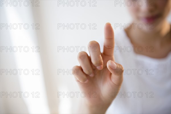 Close up of Hispanic woman pointing