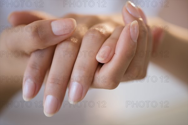 Close up of hands of Hispanic woman