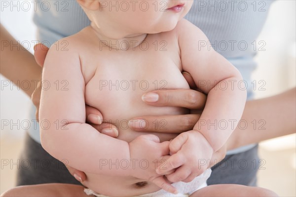 Close up of mother holding baby