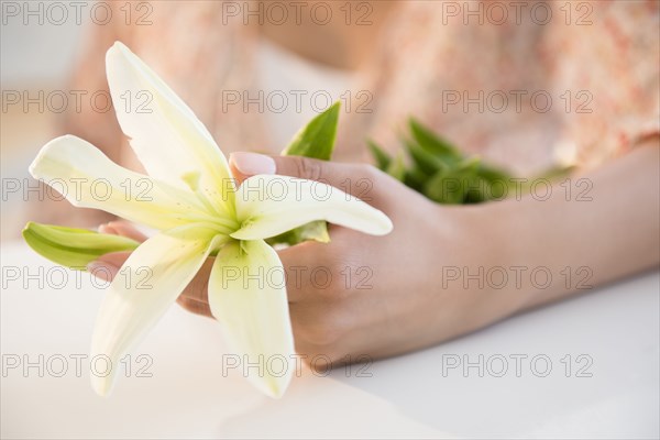 Hispanic woman holding flowers