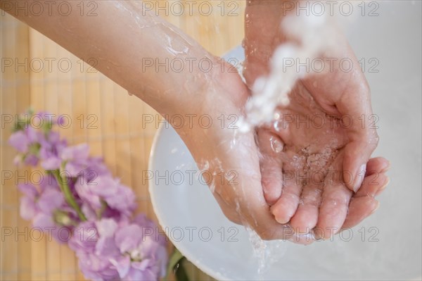 Hispanic woman washing hands