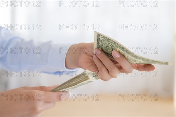 Hispanic woman counting money