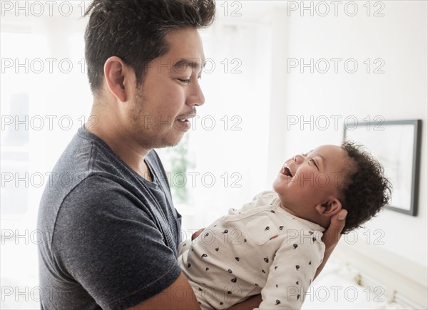 Father holding baby son