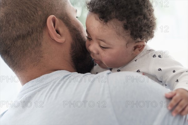 Father holding baby son