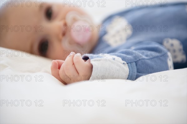 Caucasian baby girl with pacifier