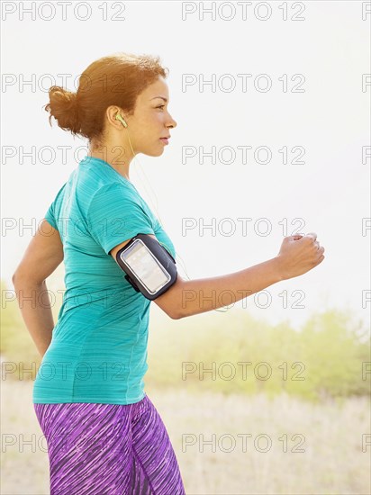 Mixed race woman jogging outdoors