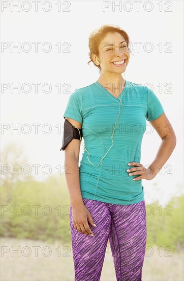 Mixed race runner smiling outdoors