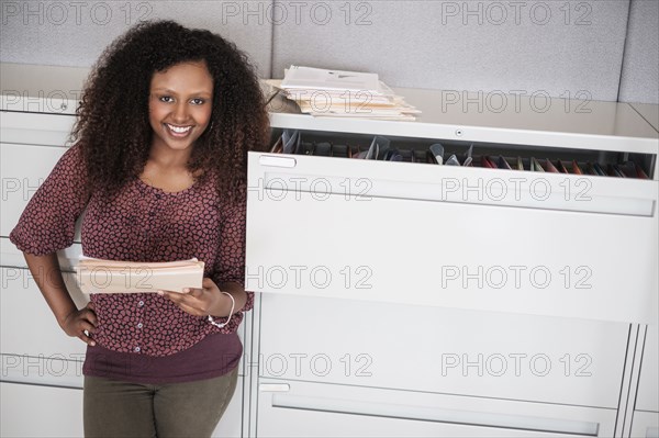 Black businesswoman smiling in office