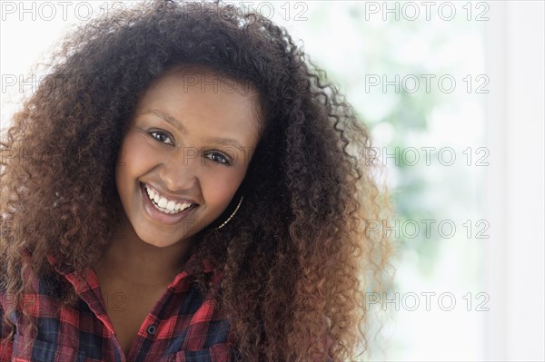 Black woman smiling indoors