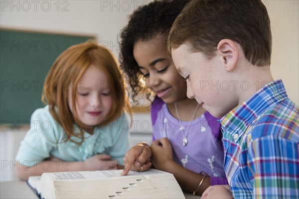 Students using dictionary in classroom