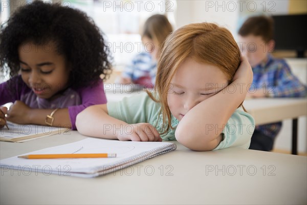 Frustrated student working in classroom