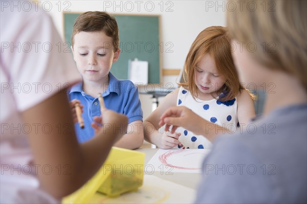 Students drawing in classroom