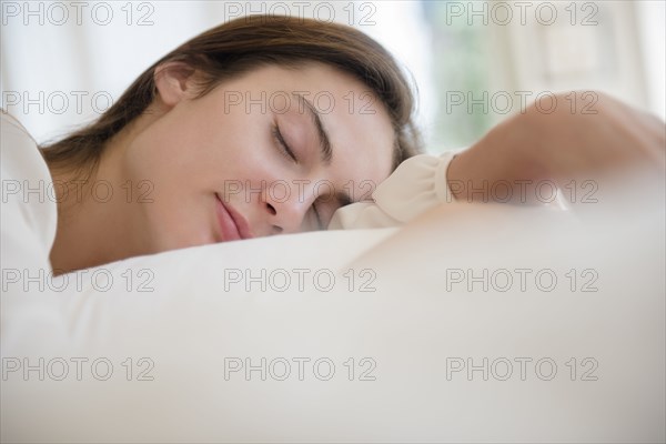 Native American woman sleeping in bed