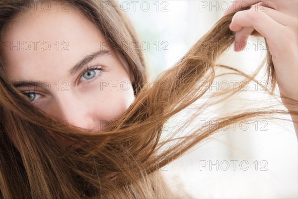 Native American woman playing with hair