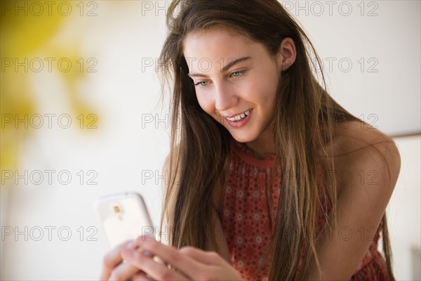 Native American woman using cell phone