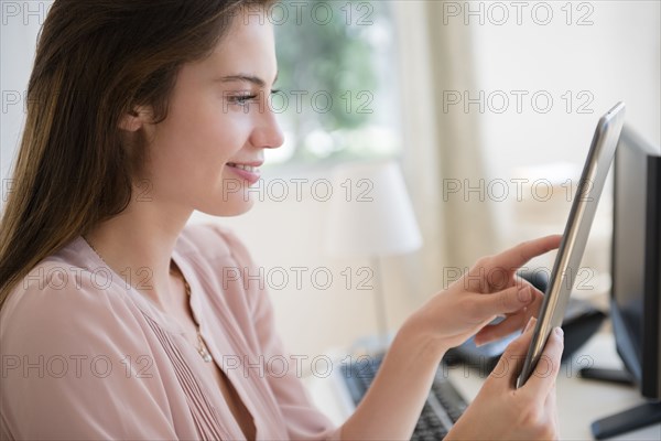 Native American businesswoman using digital tablet