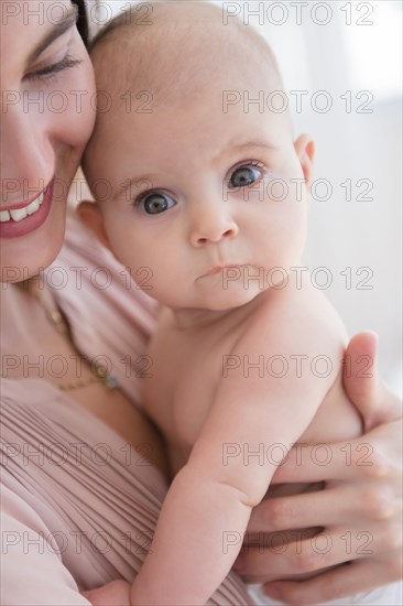 Close up of mother holding baby girl