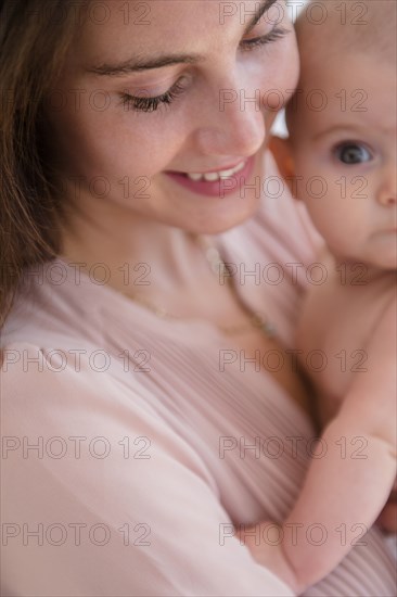 Close up of mother holding baby girl