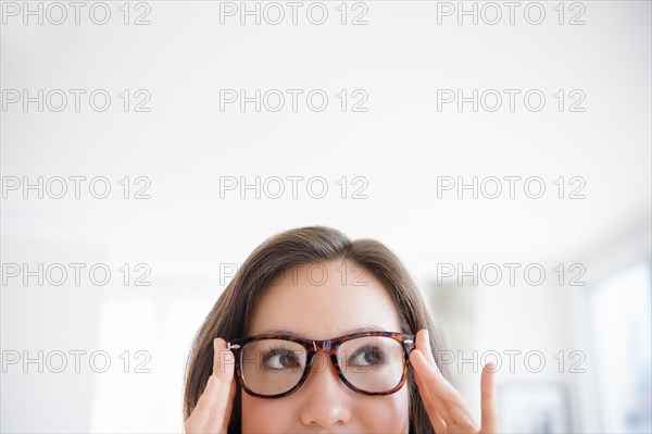 Mixed race woman wearing eyeglasses