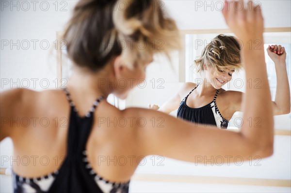 Mixed race dancer practicing in studio