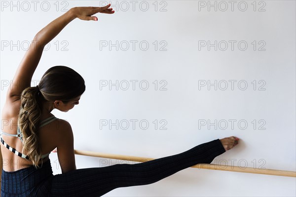 Mixed race dancer practicing in studio