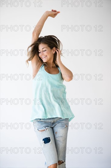 Mixed race woman dancing