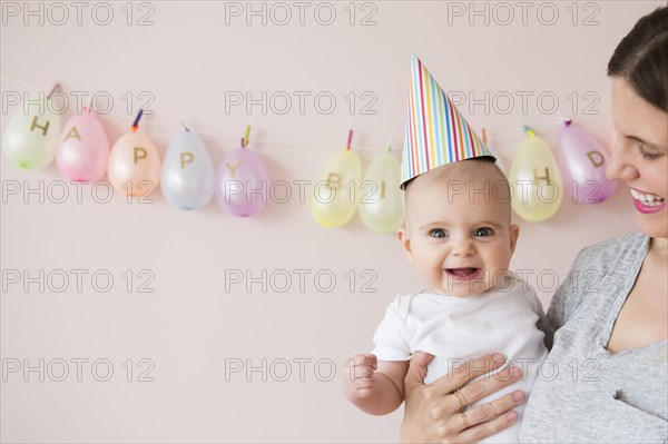 Caucasian mother and daughter celebrating birthday