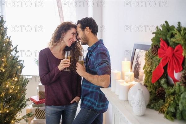 Couple drinking champagne at Christmas