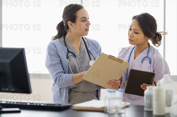 Doctor and nurse talking in hospital