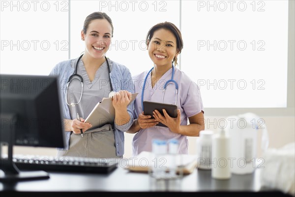 Doctor and nurse smiling in hospital