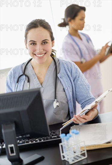 Nurse holding medical chart in hospital