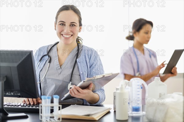 Nurse holding medical chart in hospital