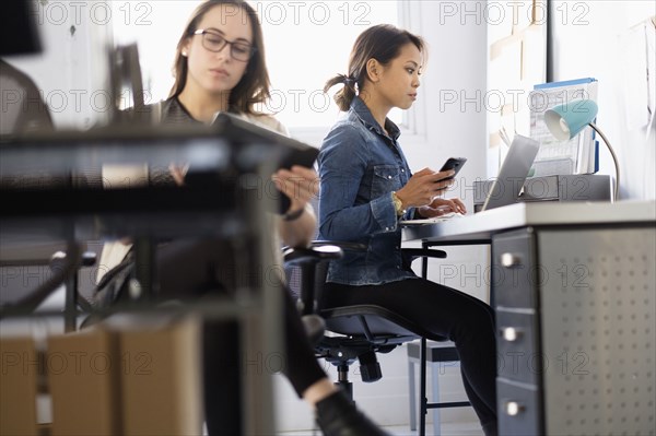 Businesswoman using digital tablet in office