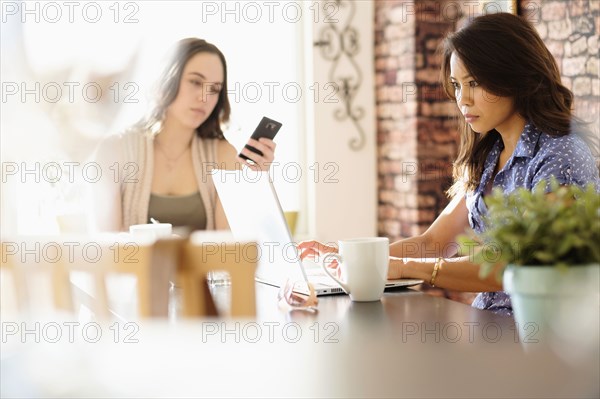 Woman working in coffee shop