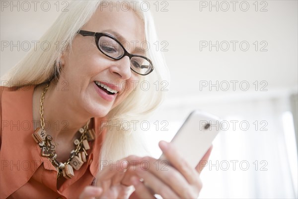 Caucasian woman using cell phone