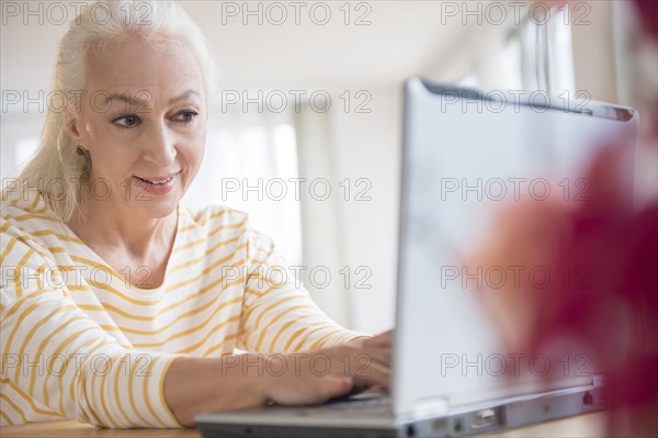 Caucasian woman using laptop