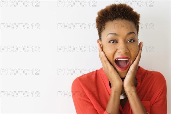 Mixed race woman gasping