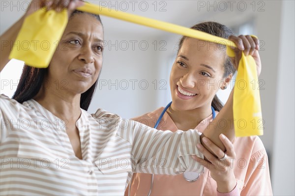 Patient having physical therapy in living room