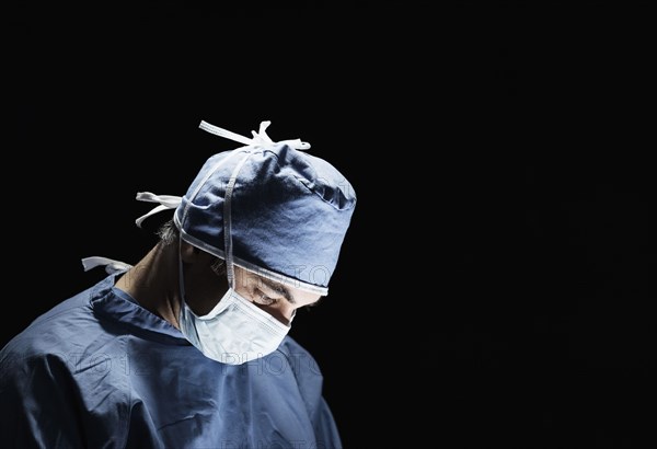 Mixed race surgeon working in operating room