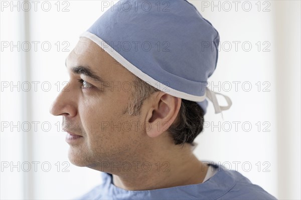 Mixed race surgeon wearing scrubs