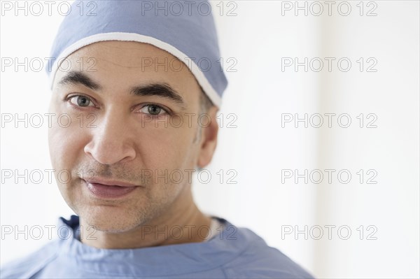 Mixed race surgeon wearing scrubs