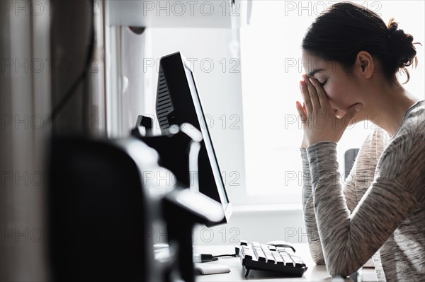 Hispanic woman using computer